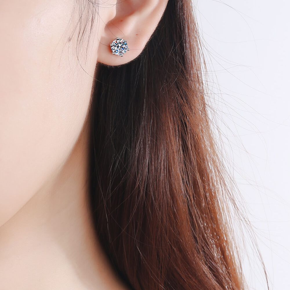 Photo of a woman wearing silver jewelry stud earrings