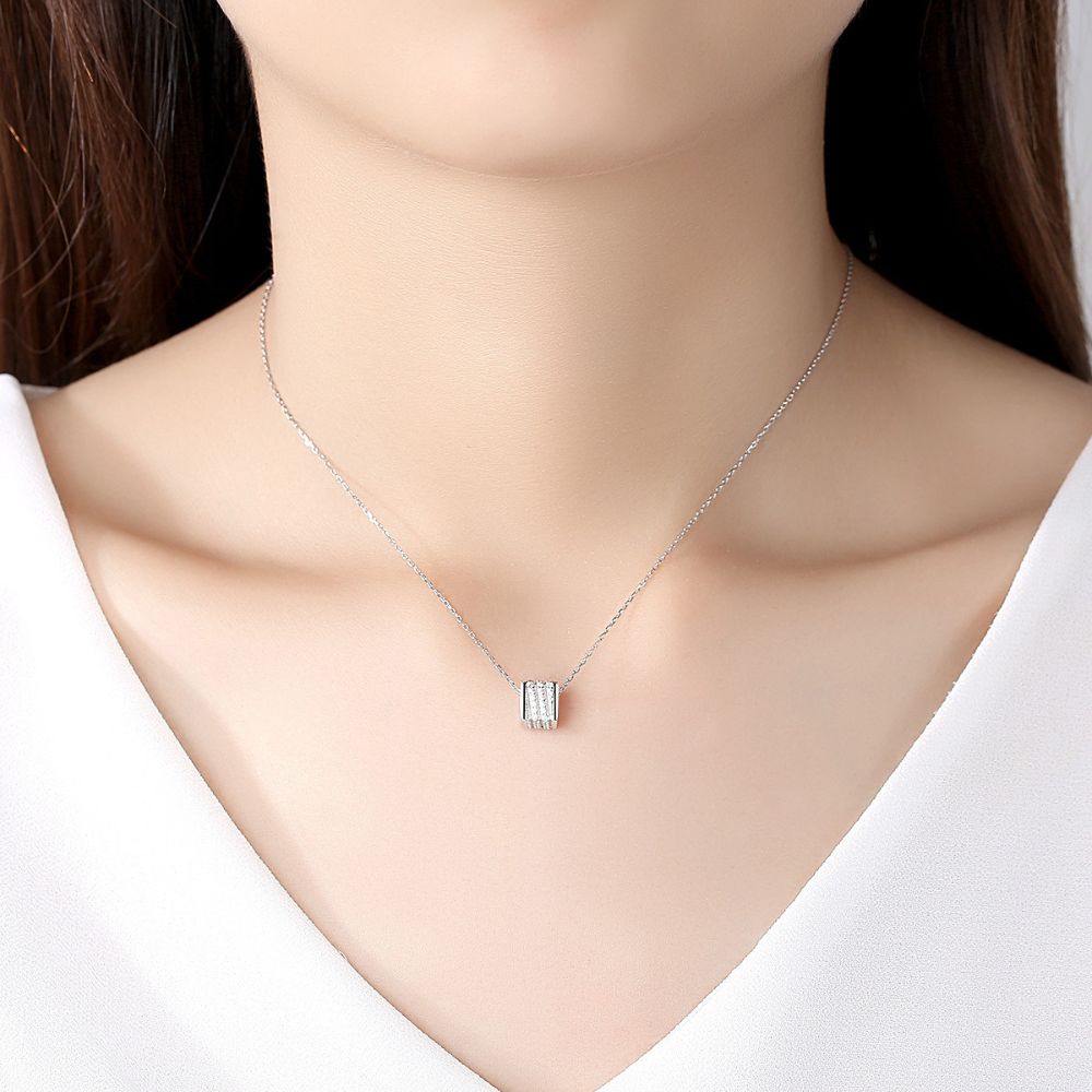 Photo of a woman wearing silver jewelry necklace