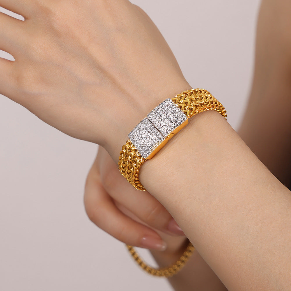 Photo of a woman wearing gold watch chain with diamond