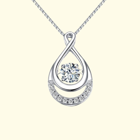 Photo of a silver hanging necklace with diamond