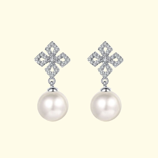 Photo of silver moissanite earrings with freshwater pearl